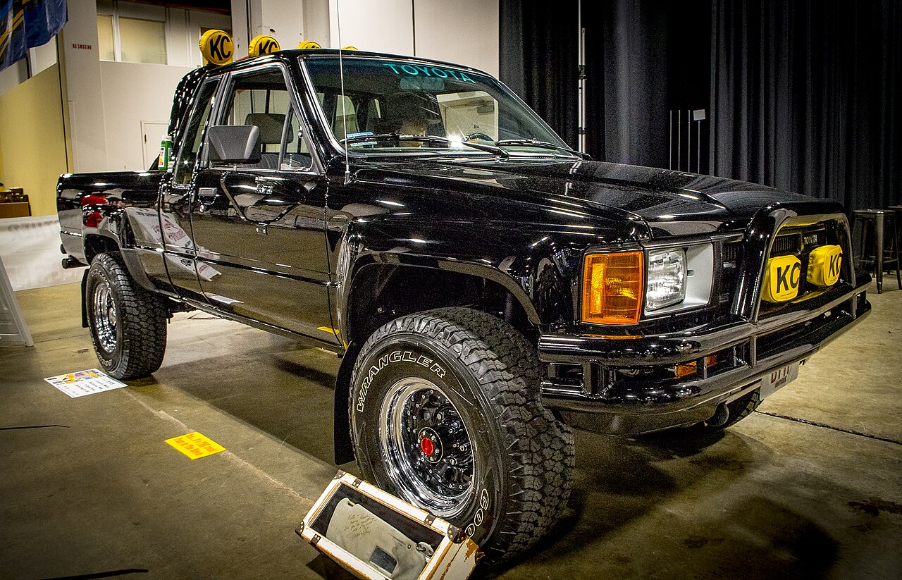 Black 1985 Toyota SR5 pickup displayed at World of Wheels Boston in 2016.